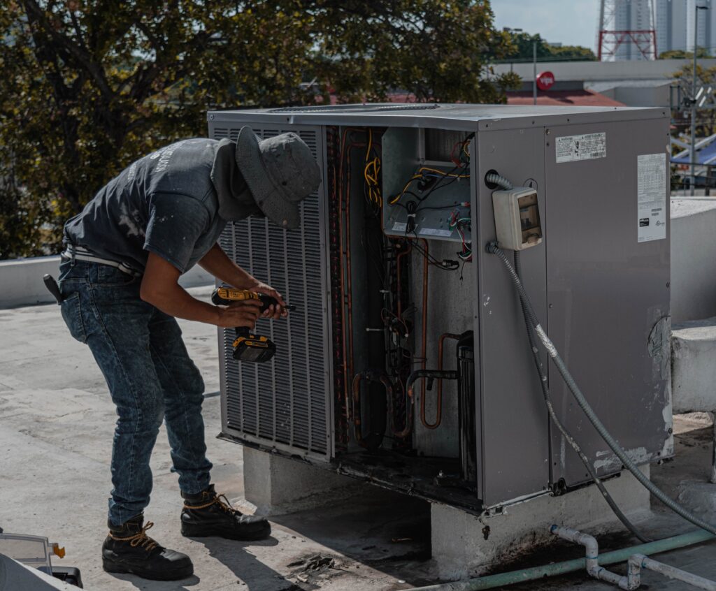 Repairman Repairing a Air Conditioner